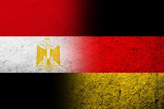 The national flag of Germany with Egypt National flag. Grunge background