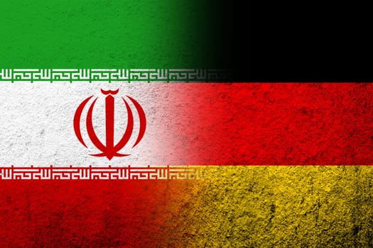 The national flag of Germany with  Iran National flag. Grunge background