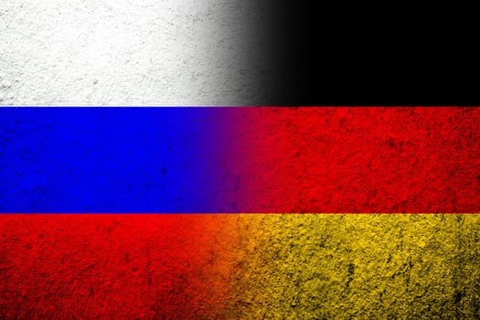 The national flag of Germany with National flag of Russian Federation. Grunge background