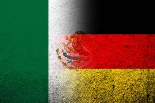 The national flag of Germany with Mexico National flag. Grunge background