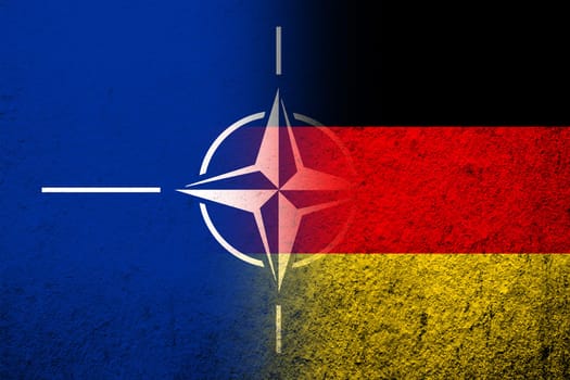 The national flag of Germany with Flag of North Atlantic Alliance NATO. Grunge background