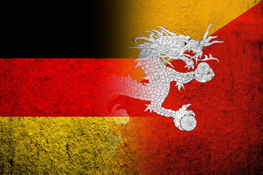 The national flag of Germany with Kingdom of Bhutan National flag. Grunge background
