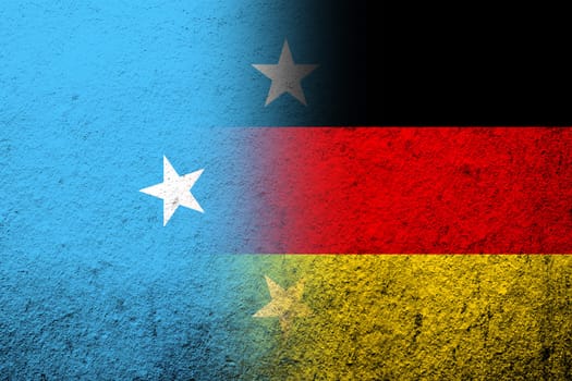 The national flag of Germany with Micronesia national flag. Grunge background