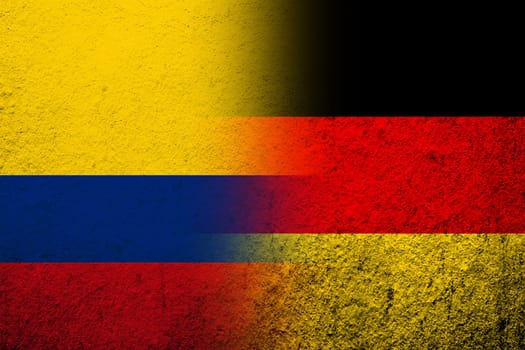 The national flag of Germany with National flag of Colombia. Grunge background