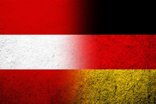 The national flag of Germany with National flag of Austria. Grunge background
