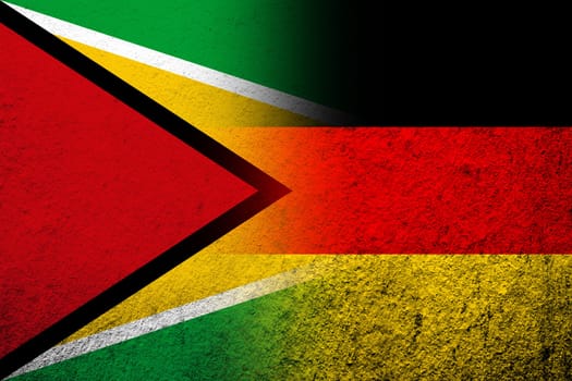The national flag of Germany with Republic of Guyana National flag. Grunge background