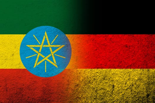The national flag of Germany with Republic of Ethiopia National flag. Grunge background
