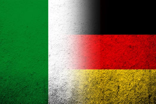The national flag of Germany with National flag of Italy. Grunge background