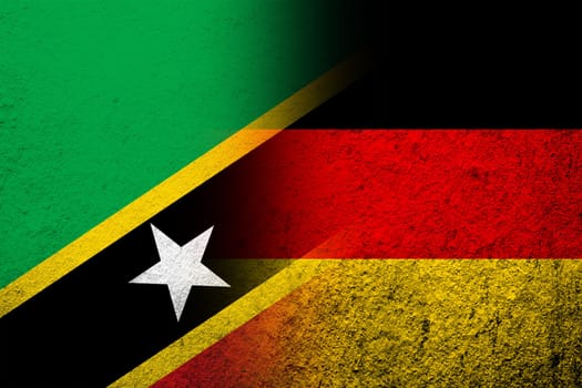 The national flag of Germany with Saint Kitts and Nevis National flag. Grunge background