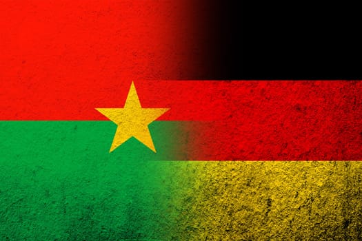 The national flag of Germany with National flag of Burkina Faso. Grunge background