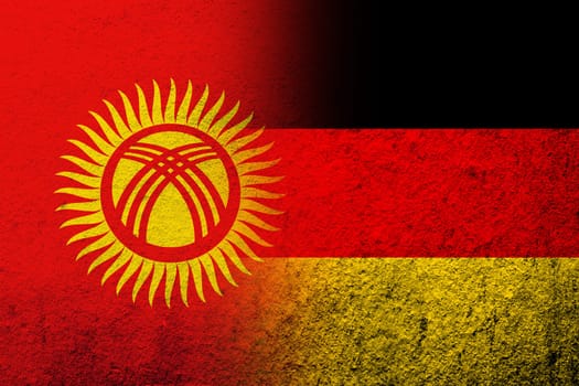 The national flag of Germany with The Kyrgyz Republic Kyrgyzstan National flag. Grunge background