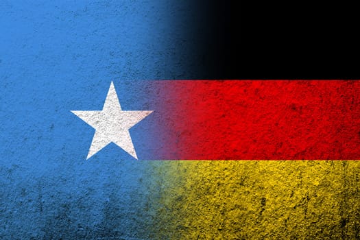 The national flag of Germany with Republic of Somalia National flag. Grunge background