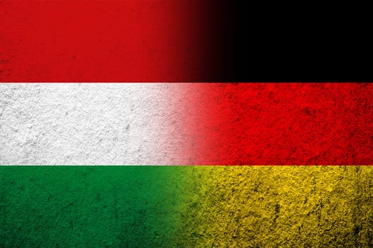 The national flag of Germany with National flag of Hungary. Grunge background