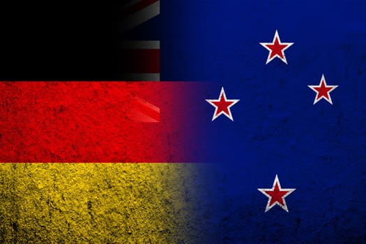 The national flag of Germany with National flag of New Zealand. Grunge background
