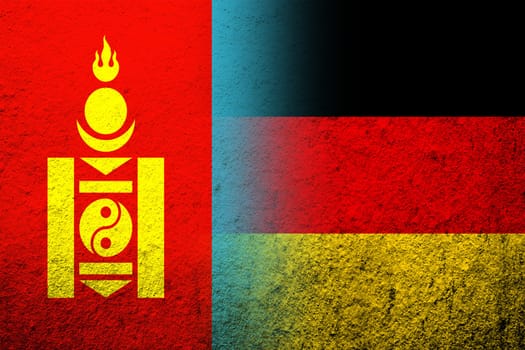 The national flag of Germany with National flag of Mongolia. Grunge background