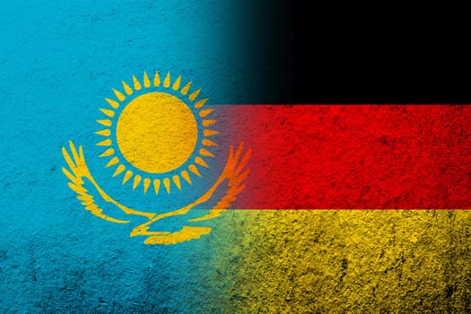 The national flag of Germany with The Republic of Kazakhstan National flag. Grunge background