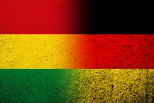 The national flag of Germany with Plurinational State of Bolivia National flag. Grunge background