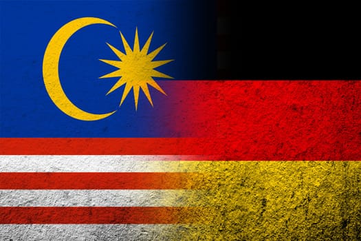 The national flag of Germany with National flag of Malaysia. Grunge background