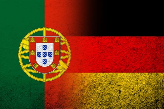 The national flag of Germany with Portugal National flag. Grunge background