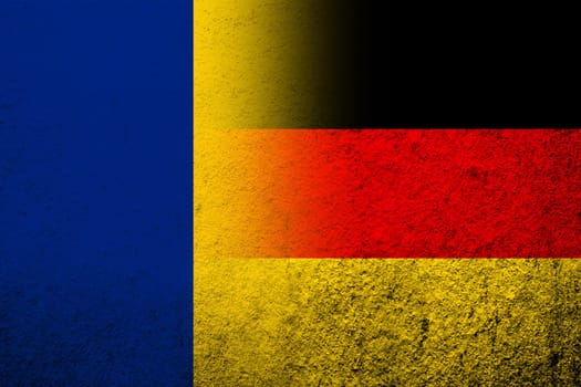 The national flag of Germany with National flag of Romania. Grunge background