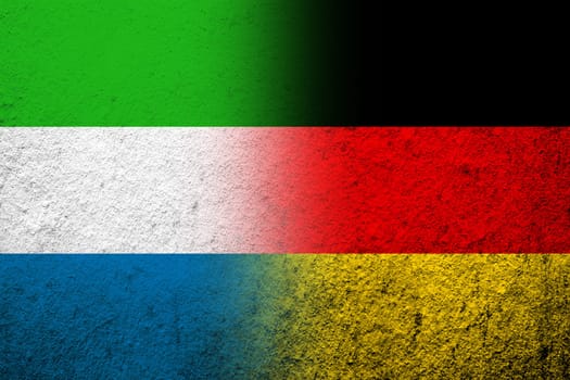 The national flag of Germany with Sierra Leone Salone National flag. Grunge background