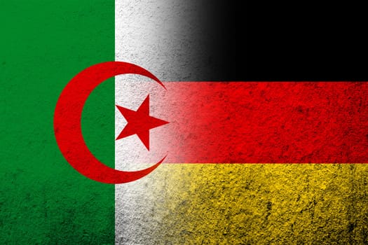 The national flag of Germany with Republic of Algeria national flag. Grunge background