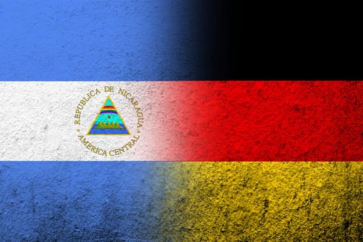 The national flag of Germany with The Republic of Nicaragua National flag. Grunge background