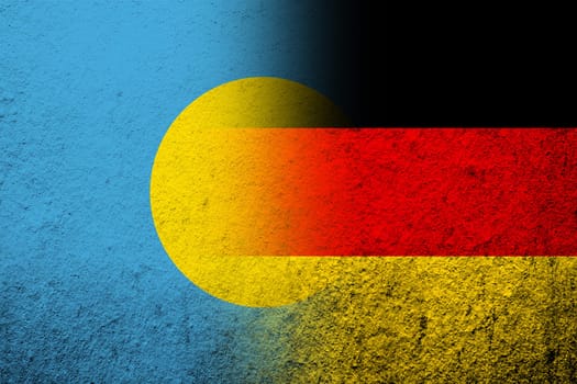 The national flag of Germany with The Republic of Palau National flag. Grunge background
