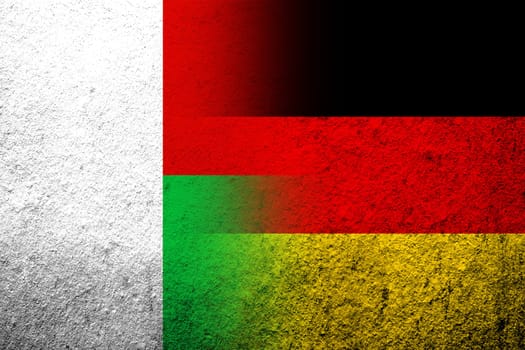 The national flag of Germany with The Republic of Madagascar National flag. Grunge background