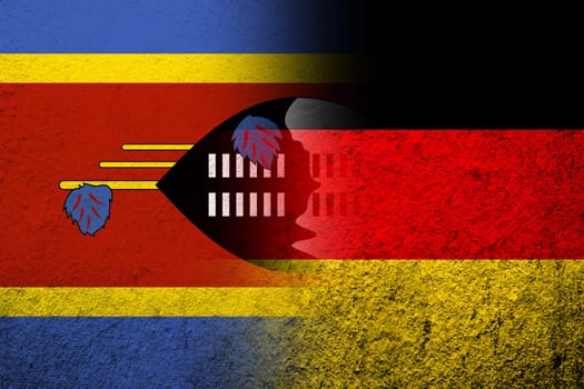 The national flag of Germany with The Kingdom of Eswatini Swaziland National flag. Grunge background