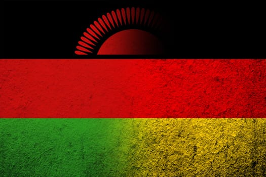 The national flag of Germany with The Republic of Malawi National flag. Grunge background