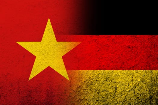 The national flag of Germany with The Socialist Republic of Vietnam National flag. Grunge background
