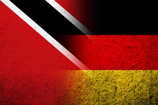 The national flag of Germany with The Republic of Trinidad and Tobago National flag. Grunge background