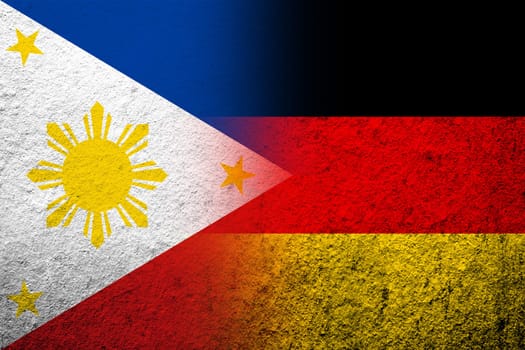 The national flag of Germany with The Republic of the Philippines National flag. Grunge background