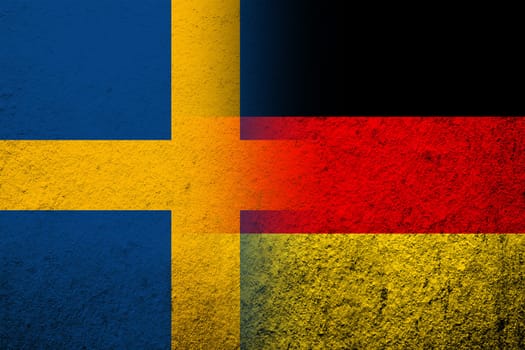 The national flag of Germany with The Kingdom of Sweden national flag. Grunge background