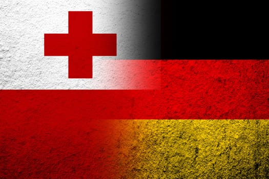 The national flag of Germany with The Kingdom of Tonga National flag. Grunge background