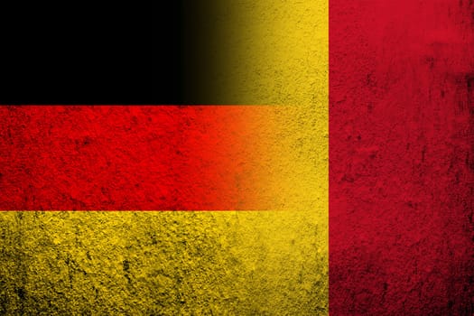 The national flag of Germany with the Republic of Mali National flag. Grunge background