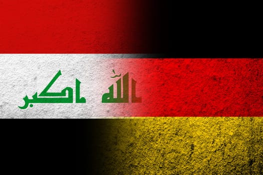The national flag of Germany with the Republic of Iraq National flag. Grunge background