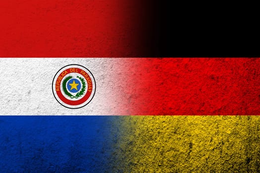 The national flag of Germany with The Republic of Paraguay National flag. Grunge background