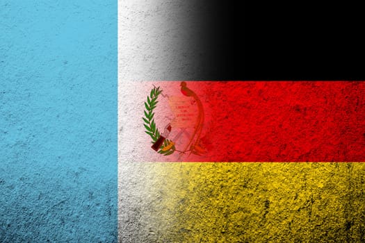 The national flag of Germany with The Republic of Guatemala National flag. Grunge background
