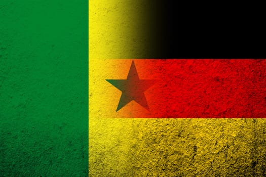 The national flag of Germany with The Republic of Senegal National flag. Grunge background