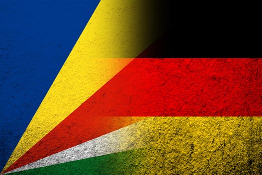 The national flag of Germany with The Republic of Seychelles National flag. Grunge background