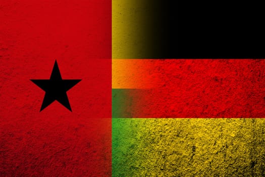 The national flag of Germany with The Republic of Guinea-Bissau National flag. Grunge background