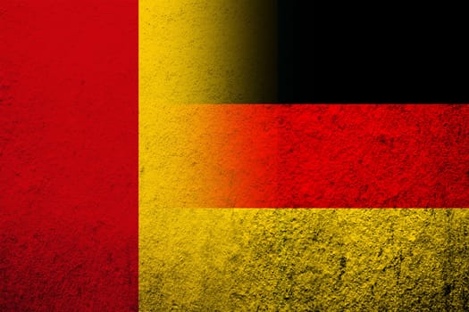 The national flag of Germany with The Republic of Guinea National flag. Grunge background