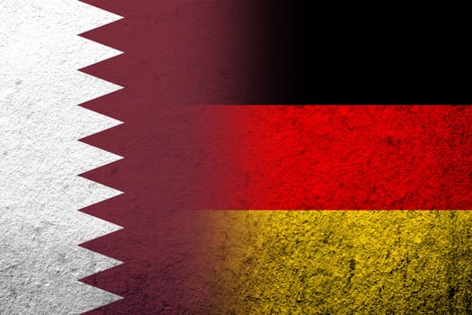 The national flag of Germany with The State of Qatar National flag. Grunge background
