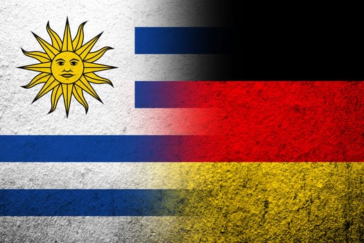 The national flag of Germany with Uruguay National flag. Grunge background