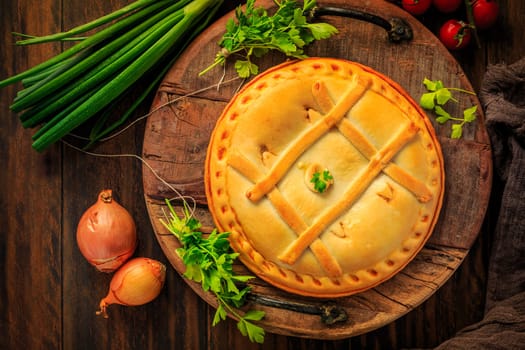 Empanada Gallega - traditional pie stuffed with tuna, Galician and Spanish cuisine. Tart with tuna and vegetables.