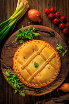 Empanada Gallega - traditional pie stuffed with tuna, Galician and Spanish cuisine. Tart with tuna and vegetables.