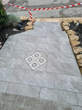 Laying ceramic floor tiles - man hands closeup