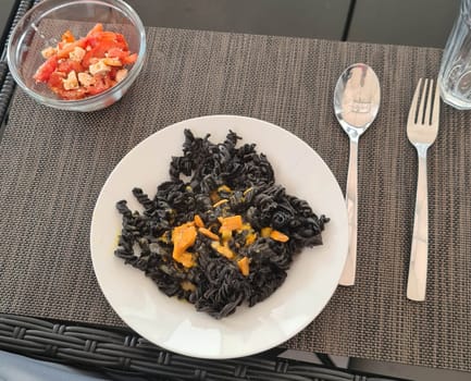 Sepia noodles with tiger shrimp and vegetables
